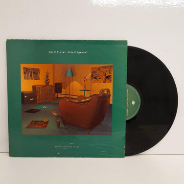 “Artificial Intelligence” compilation—green sleeve with cozy living-room scene and black vinyl record