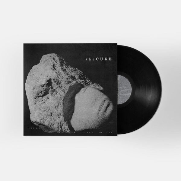 The Cure album with gray stone head sculpture on the cover and smoky marbled gray vinyl