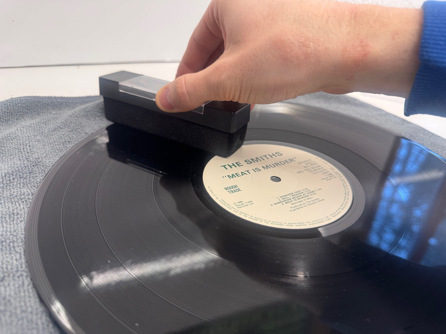 Use a carbon fibre brush to remove any surface dust or debris