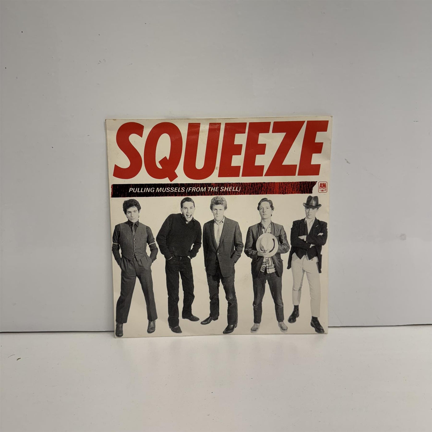 Squeeze - Pulling Mussels (From The Shell) 7" Translucent Red Vinyl Single